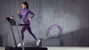 A girl running on a treadmill