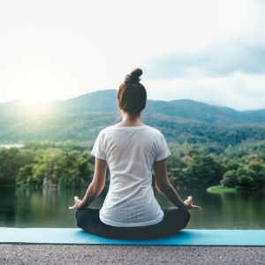 Young woman doing yoga in morning