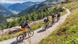 Group of people cycling around the mountain