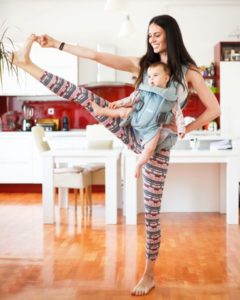 A mother doing Postpartum weight loss exercise