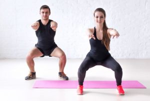 man and woman exercising