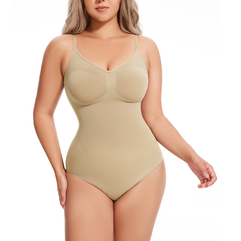 a model poses wearing the begie seamless sculpt bodysuit