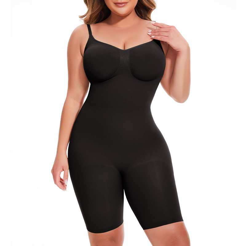 a model poses wearing the black seamless mid thigh bodysuit