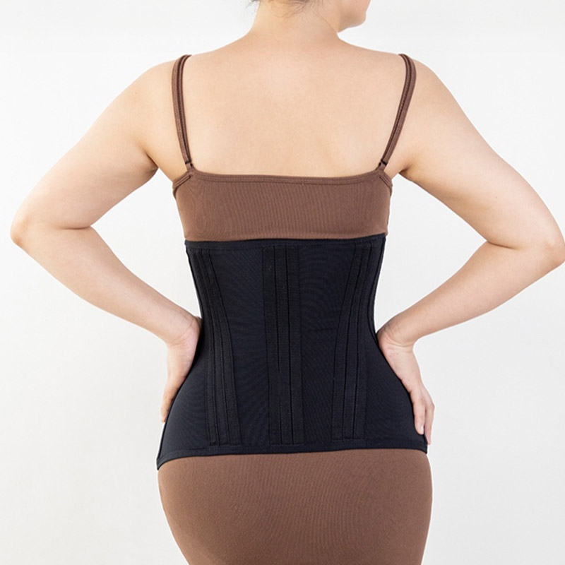 model wearing a black extreme waist trainer by back view